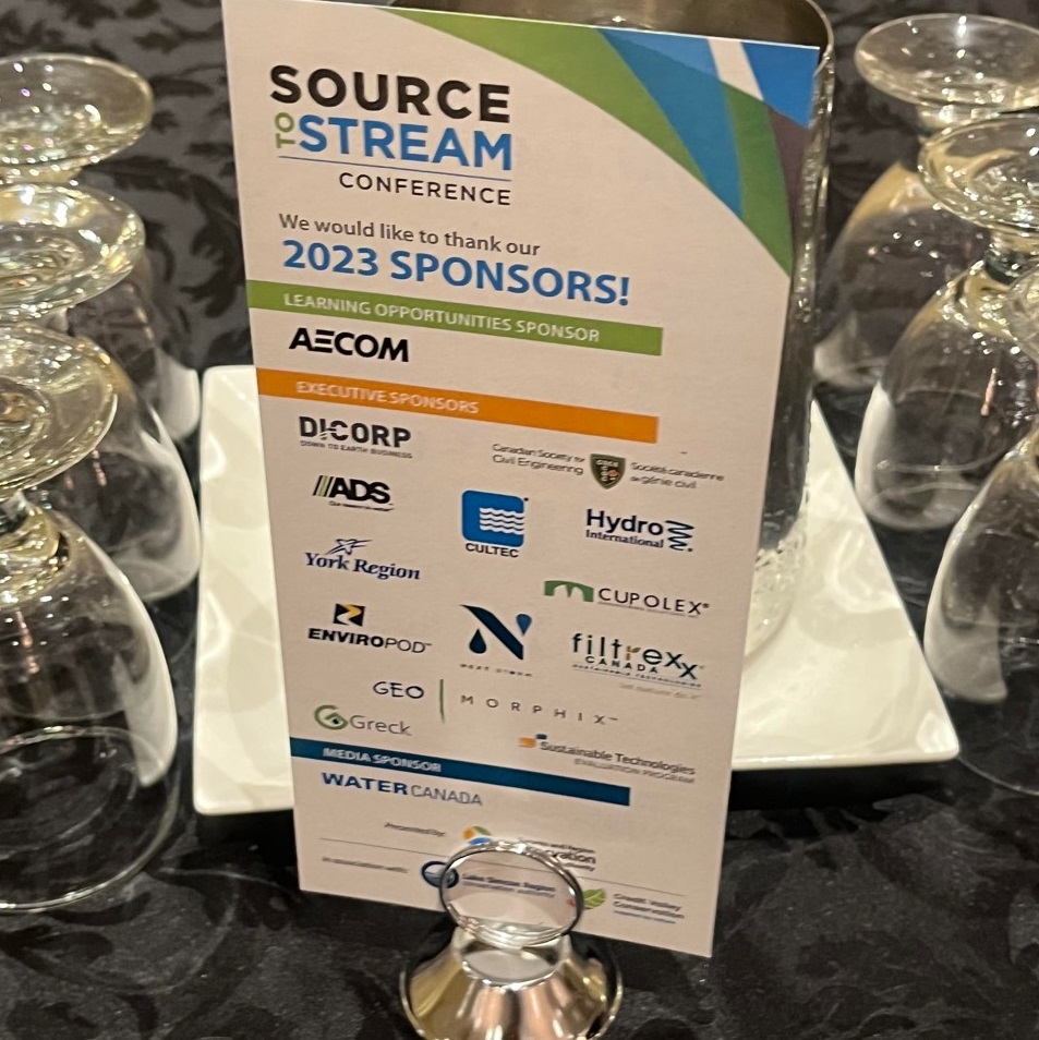 table stand at Source to Stream Conference displays sponrso logos
