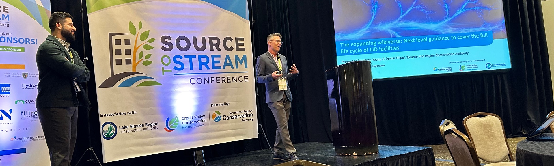 presenter leads panel discussion at Source to Stream conference